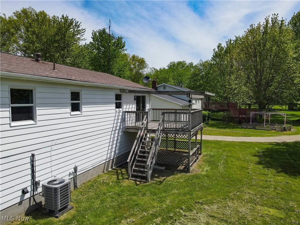 3740 Wilson Sharpsville Rd, Cortland, Ohio 44410 – Your dream home awaits! This stunning 5-bed, 3-bath single-family residence, completely renovated top-to-bottom, sits on a spacious 0.58-acre lot, blending luxury, functionality, and room to grow. Step into a bright, airy open-concept living space, perfect for modern living and effortless entertaining. The heart of the home is a gourmet kitchen featuring sleek Black Stainless Steel Samsung appliances, gorgeous Quartz Countertops, and an oversized island—ideal for meal prep, casual dining, or hosting. Enjoy abundant natural light through new windows and great installed lighting. Luxury LVT Shaw flooring flows seamlessly throughout, adding warmth and durability. Each of the three full bathrooms is beautifully updated with stylish finishes, offering a spa-like retreat.