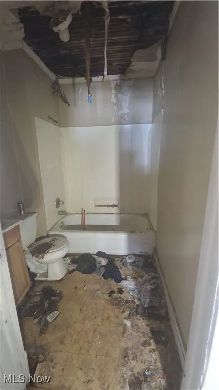 Full bath featuring  shower combination and vanity