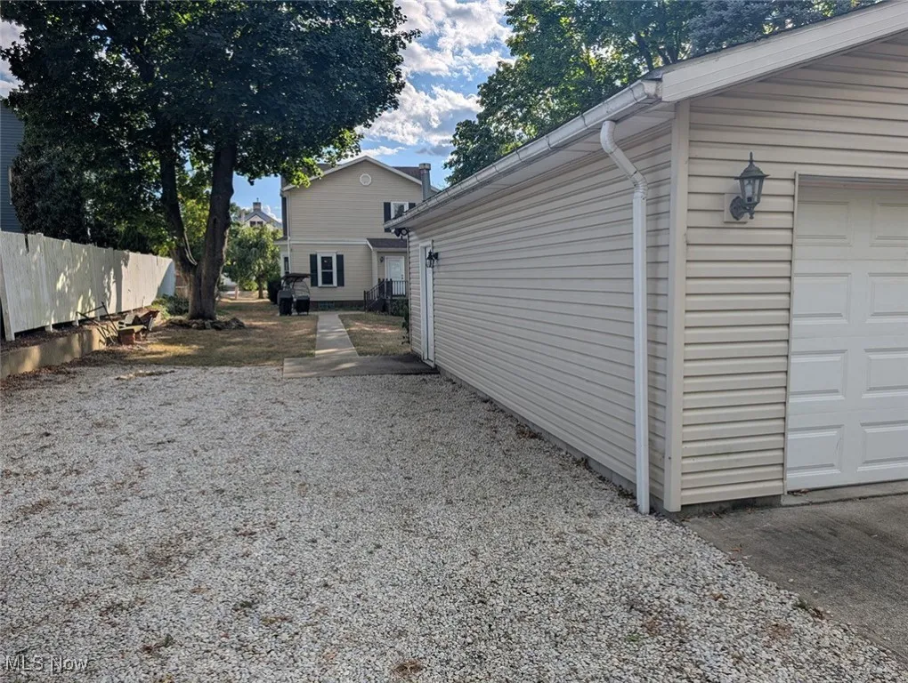 View of yard featuring a garage