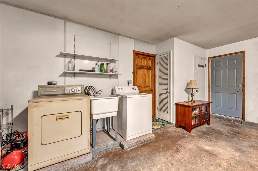 Washroom featuring washer and clothes dryer