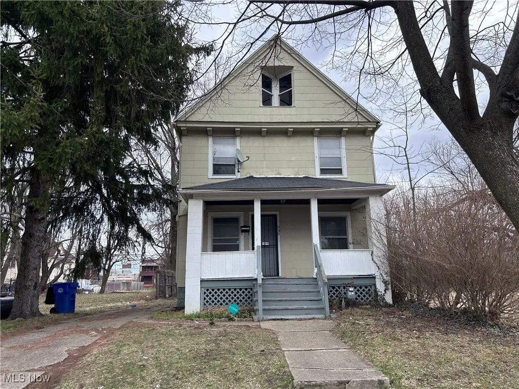 American foursquare style home with a porch