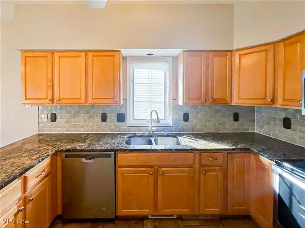 Kitchen featuring brown cabinets