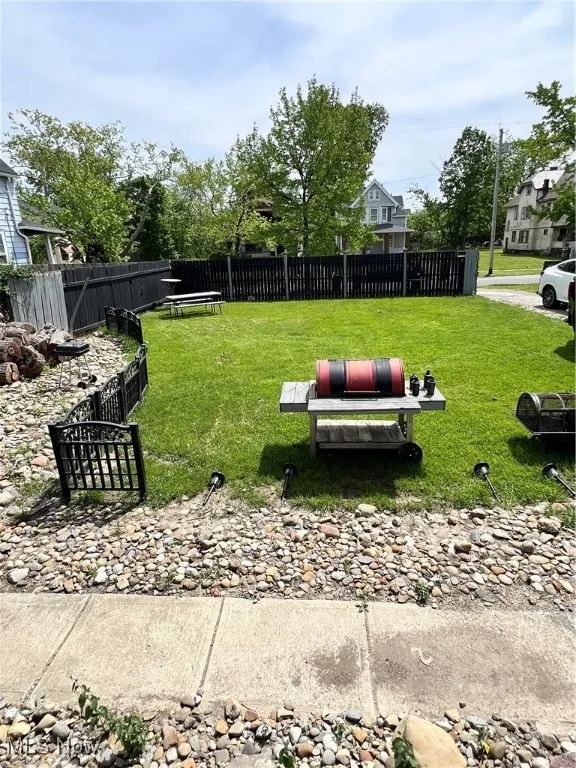 View of front yard with a patio area and a residential view