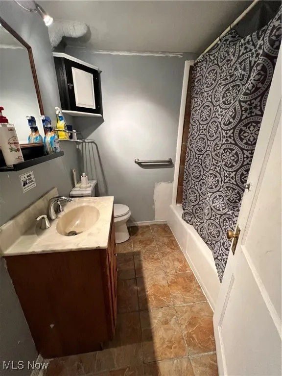 Bathroom featuring vanity and shower / tub combo with​​‌​​​​‌​​‌‌​‌‌​​​‌‌​‌​‌​‌​​​‌​​ curtain