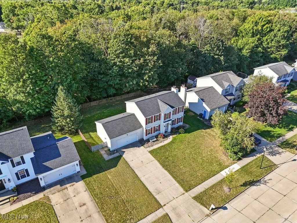 Aerial view of residential area with a forest