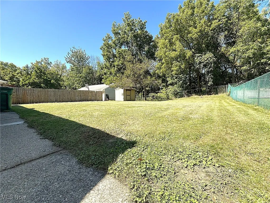 Fenced backyard with a shed