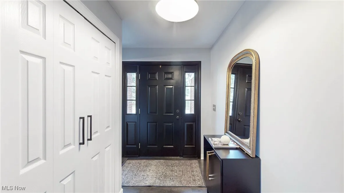 Foyer featuring dark wood-style floors