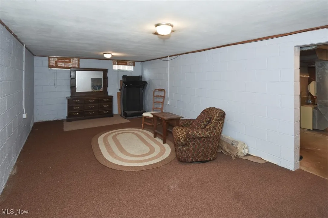 Living area with concrete block wall and heating unit