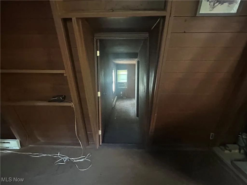 Hallway featuring cooling unit