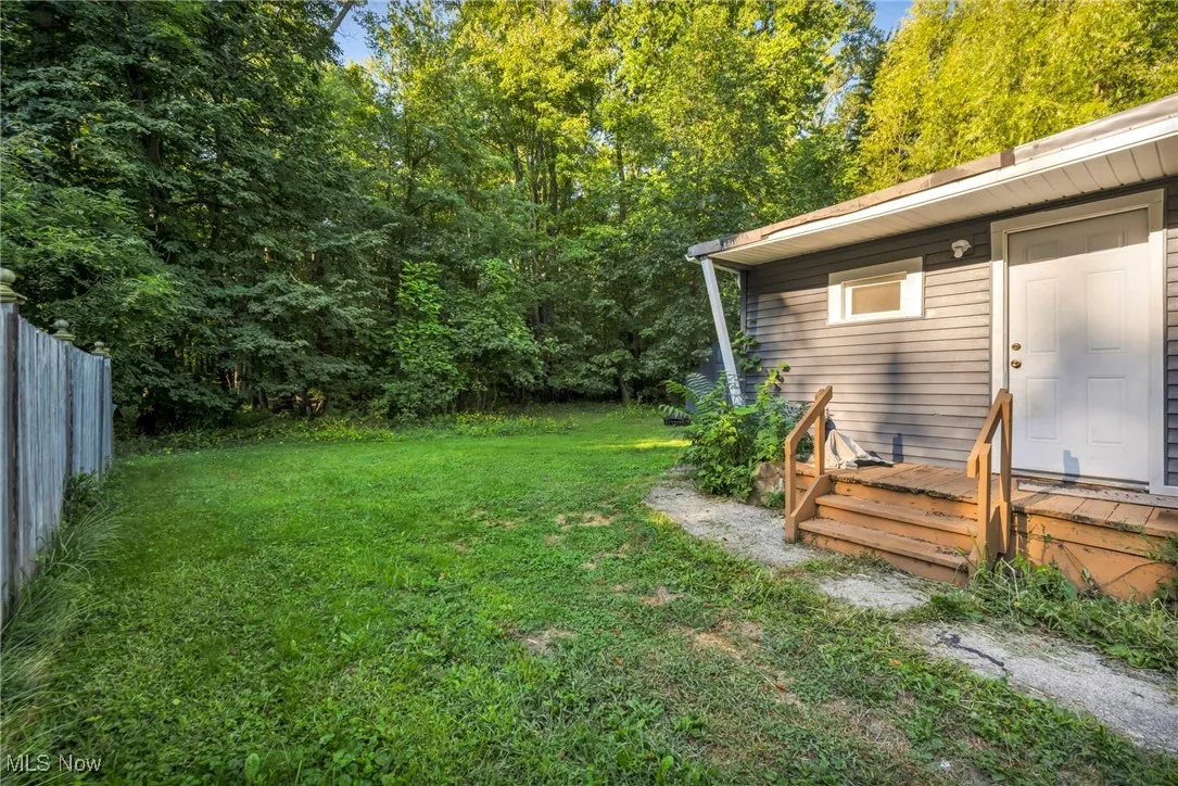 View of yard with a deck