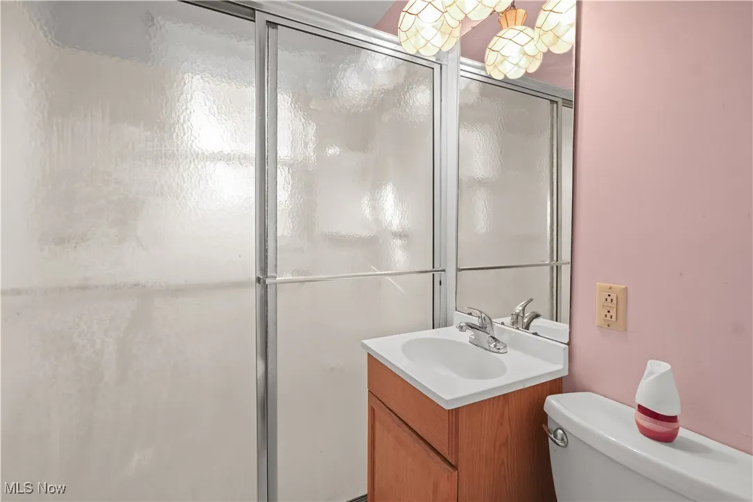 Bathroom with vanity and a shower stall
