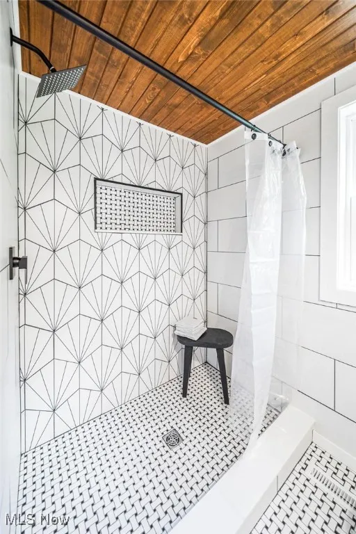 Full bath with a shower stall and wooden ceiling