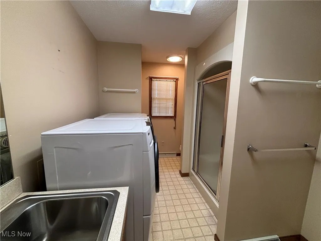 Full bath, walk in shower, laundry