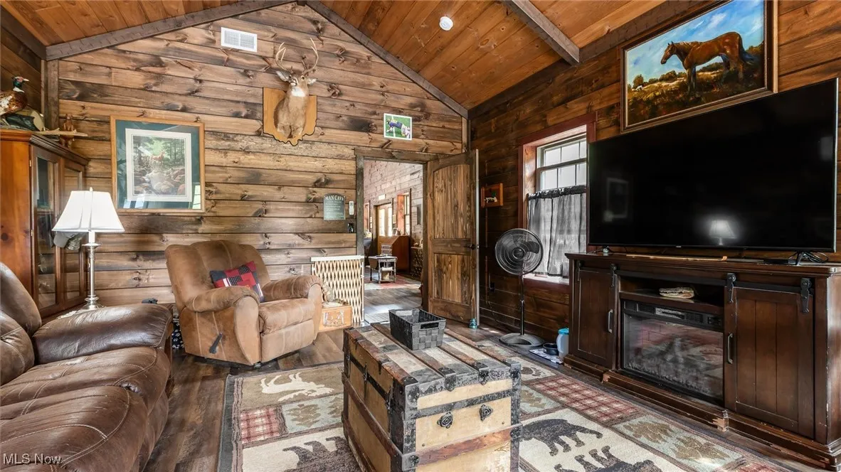 Living area with hardwood / wood-style flooring and wood ceiling