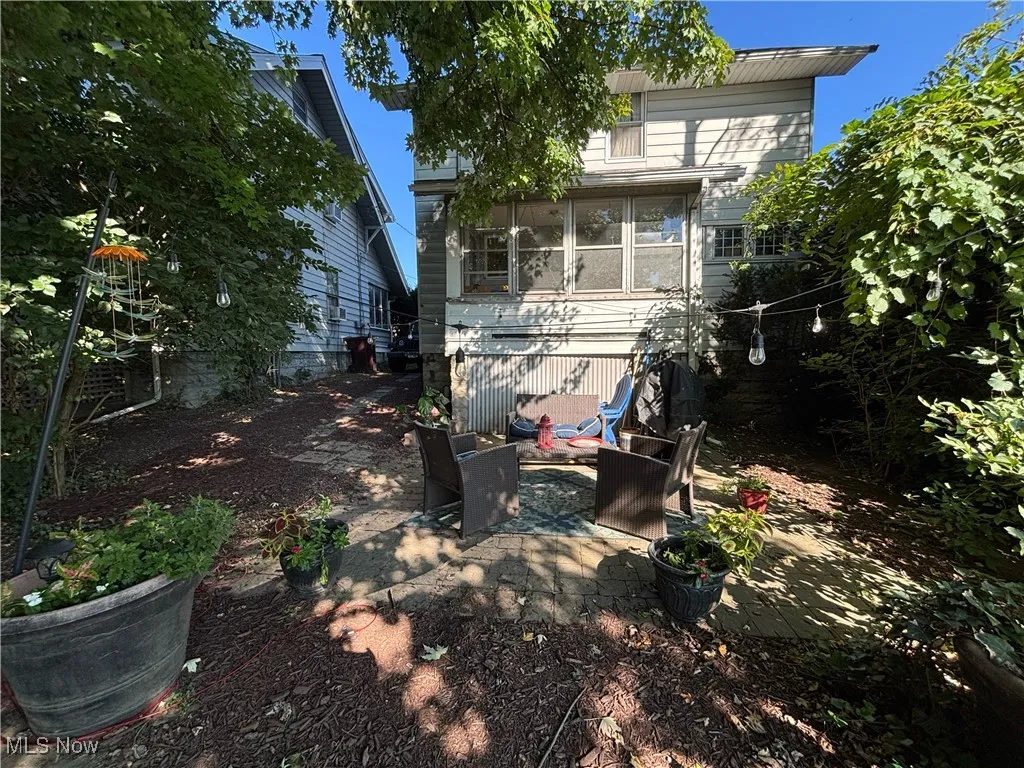 Rear view of property with a patio