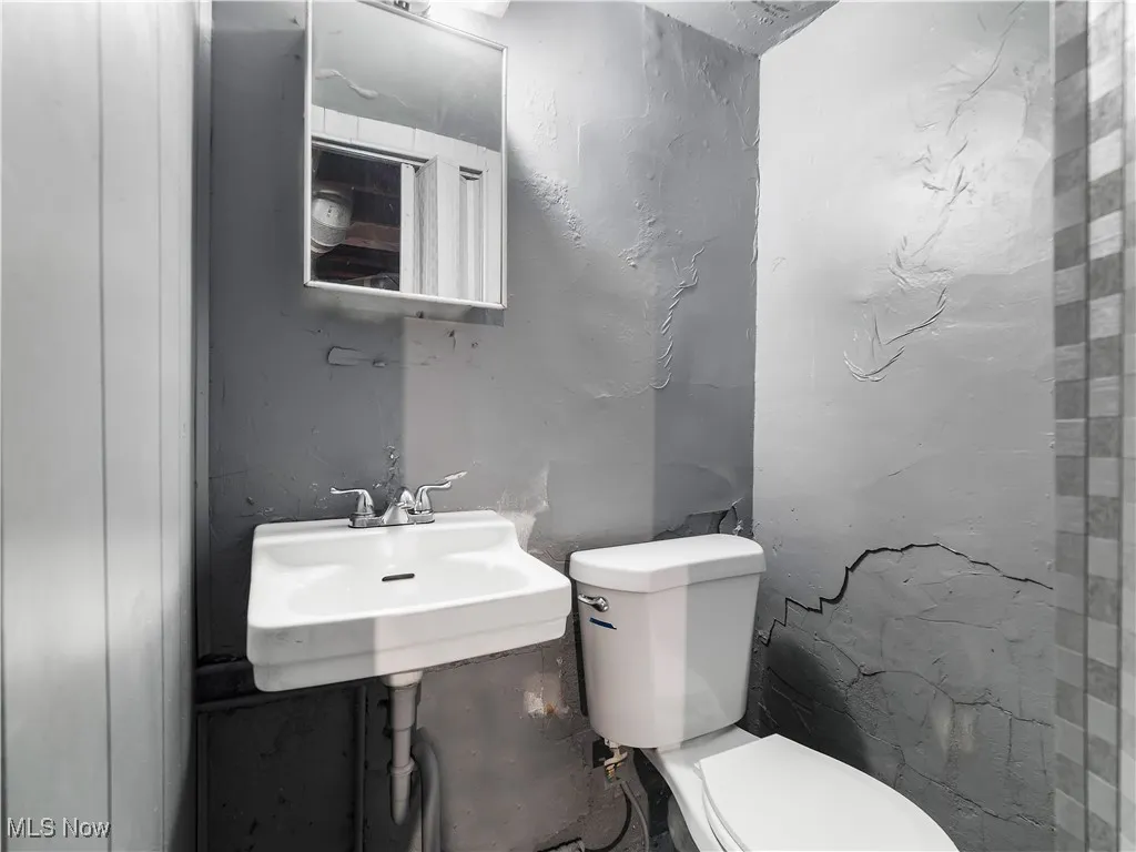 Bathroom featuring toilet and a sink