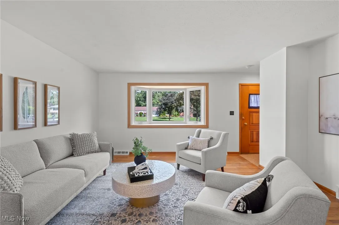 Living room featuring wood finished floors and baseboards
