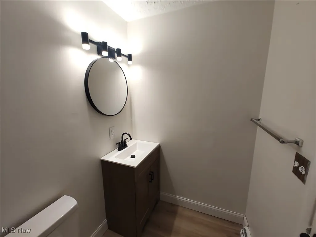 Bathroom with vanity and light wood-style flooring