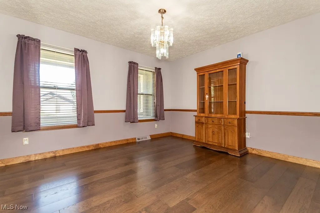 Dining room with healthy amount of natural light and chair rail