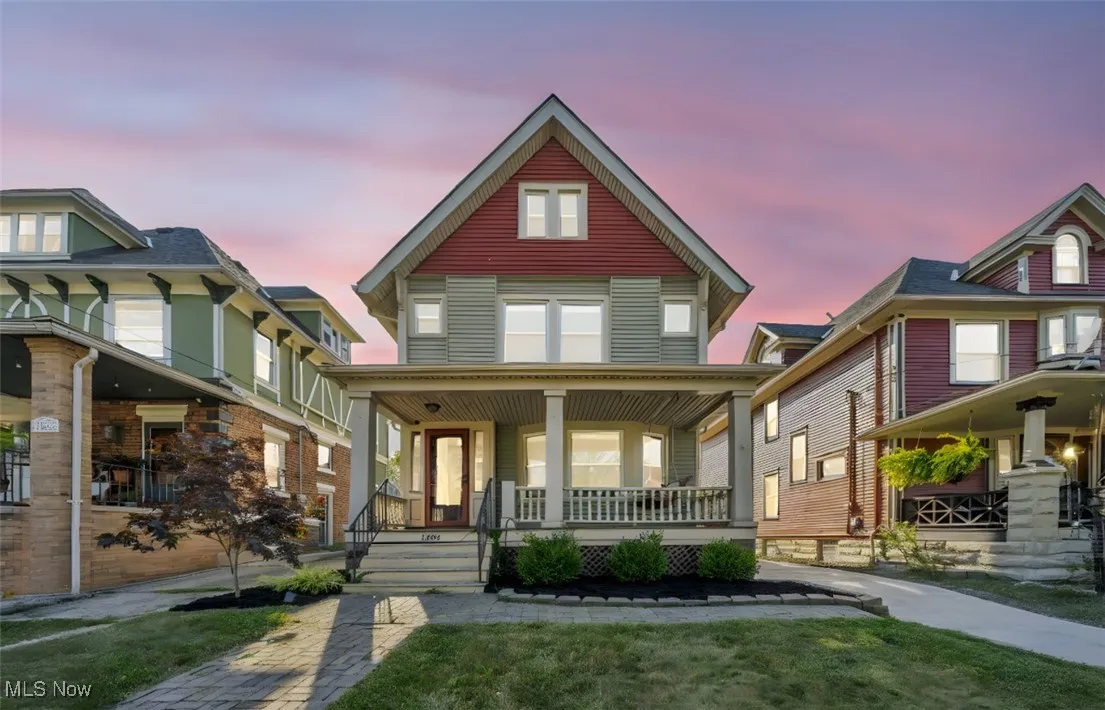 View of front of house with a porch and a front yard