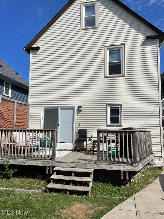 Rear view of property with a wooden deck