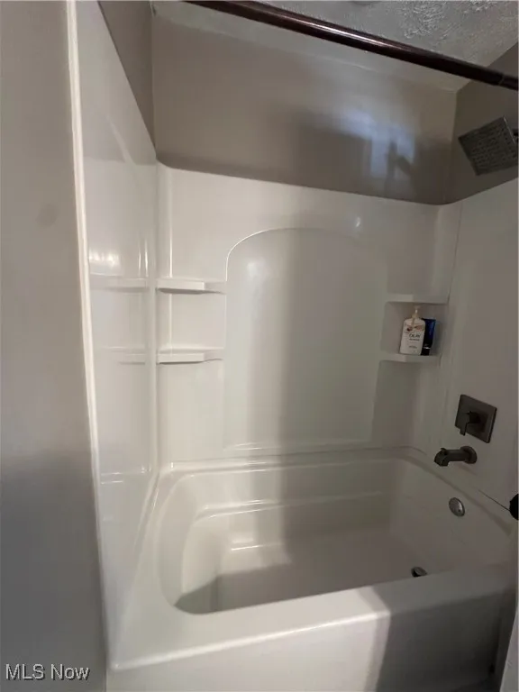 Full bathroom featuring bathing tub / shower combination