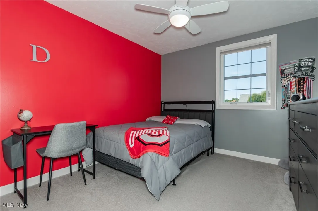 Bedroom with light carpet and ceiling fan
