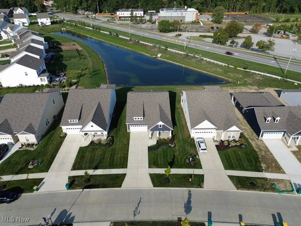 Aerial perspective of suburban area with a large body of water