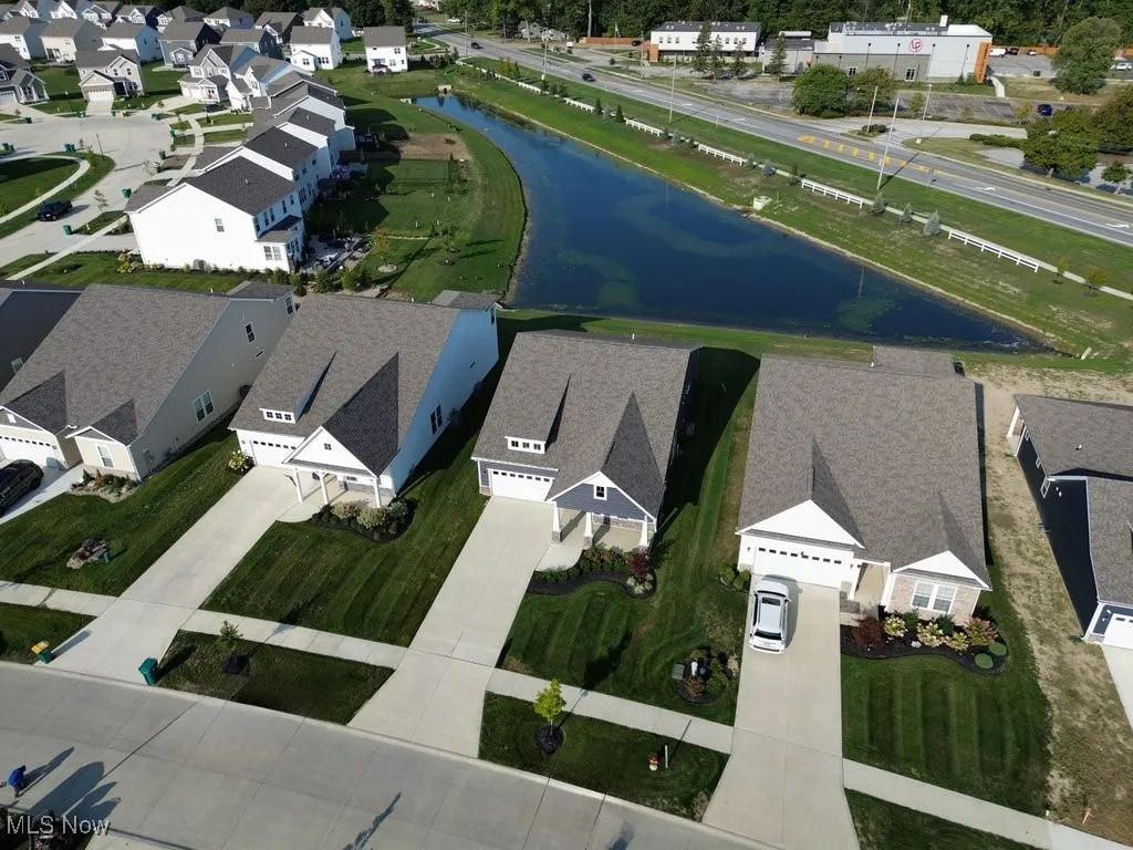 Aerial perspective of suburban area with a large body of water