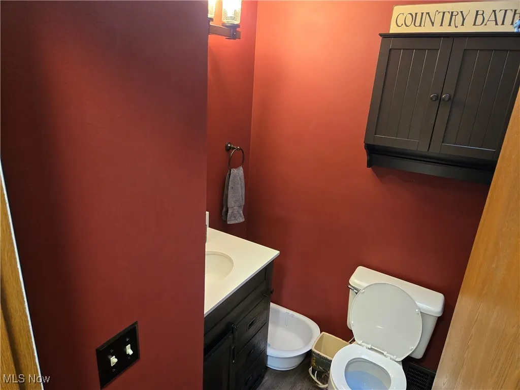 Bathroom featuring vanity and toilet