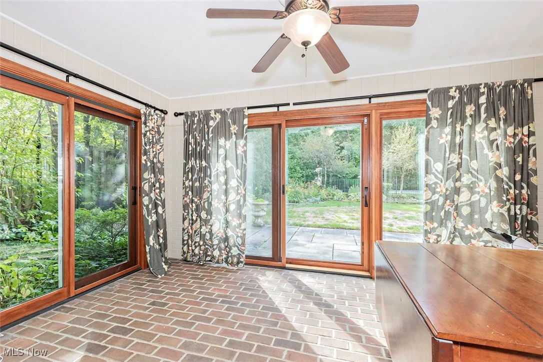 Sunroom with brick flooring