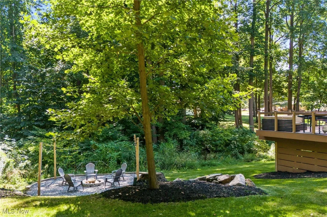 Backyard views towards creek and fire pit area.