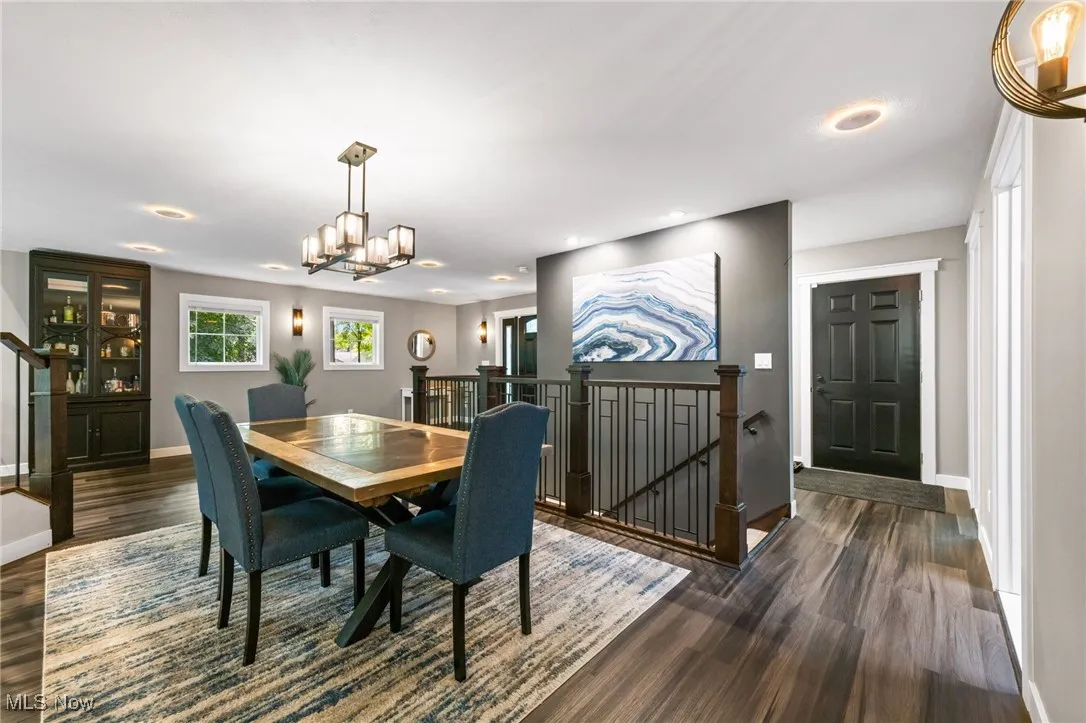 Open dining room with access to front foyer and garage.