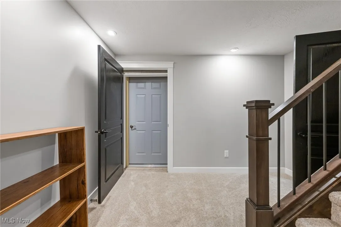 Lower level landing with access to Exterior Cold Storage room or wine cellar.