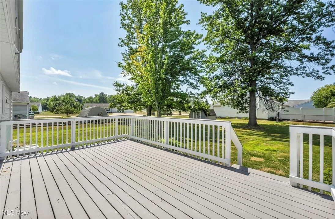 Deck featuring a lawn