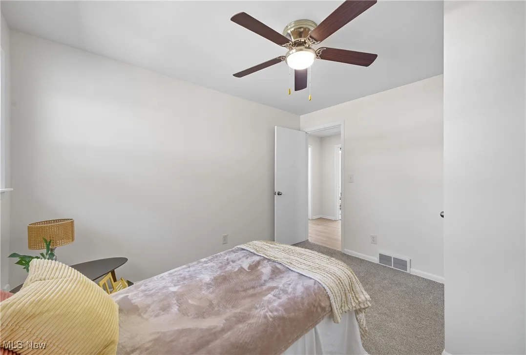 Bedroom featuring carpet floors and a ceiling fan