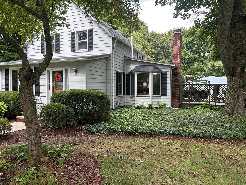 View of home's exterior with a chimney