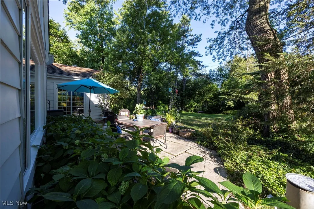 View of patio / terrace with view of scattered trees and outdoor dining area