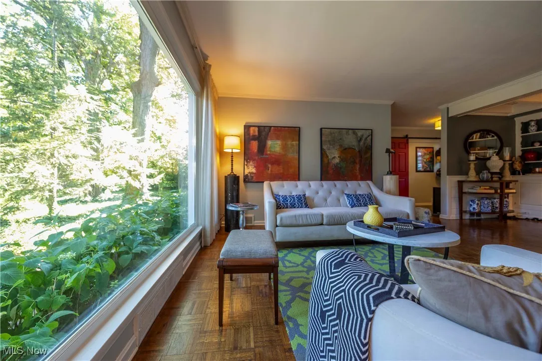 Living room featuring ornamental molding and baseboards