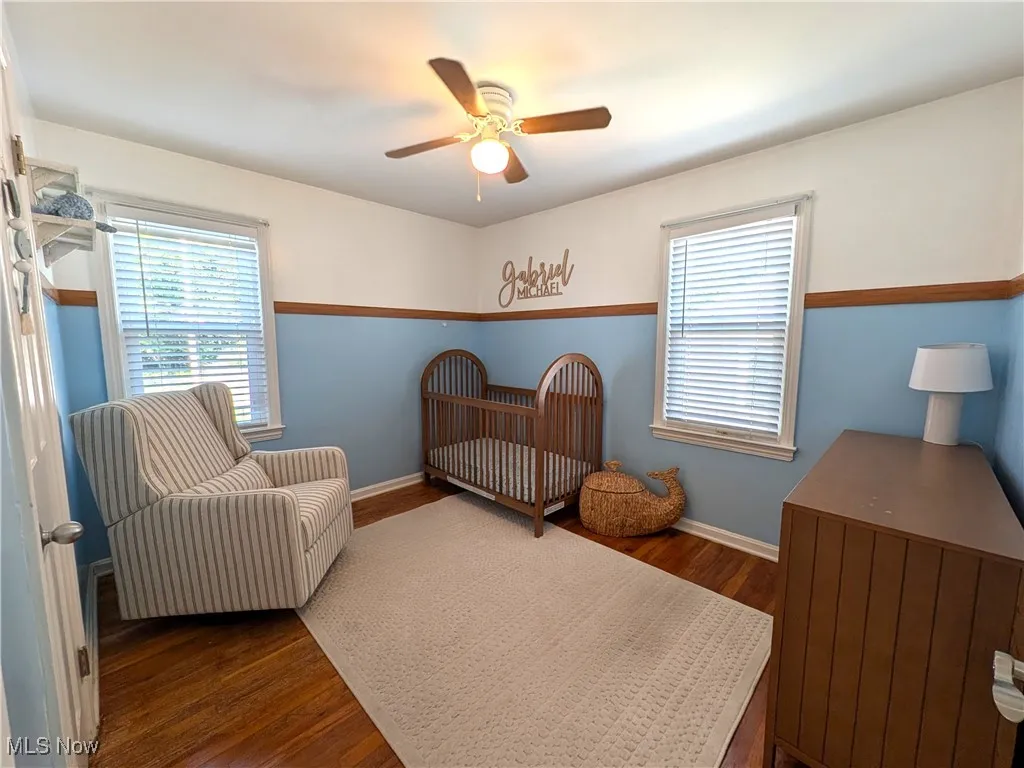 Bedroom with hardwood floors and natural light