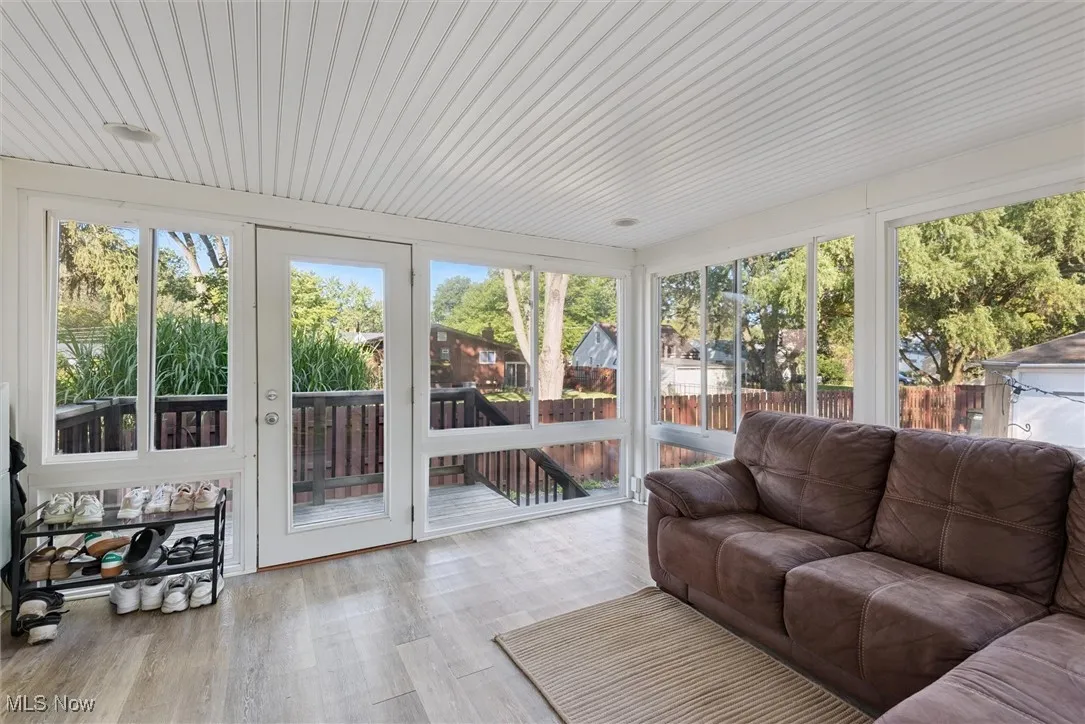 Sunroom featuring wood finished floors