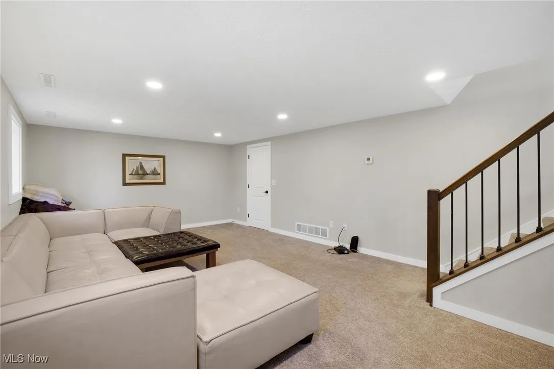 Living room featuring recessed lighting and carpet flooring