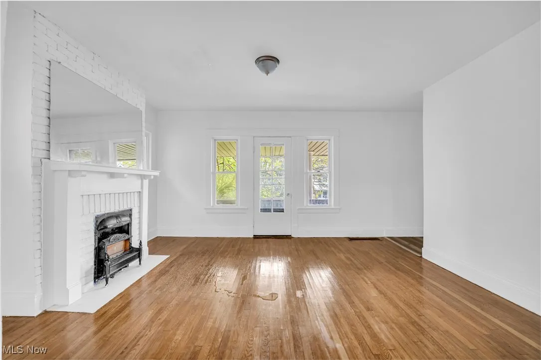 Unfurnished living room with wood-type flooring