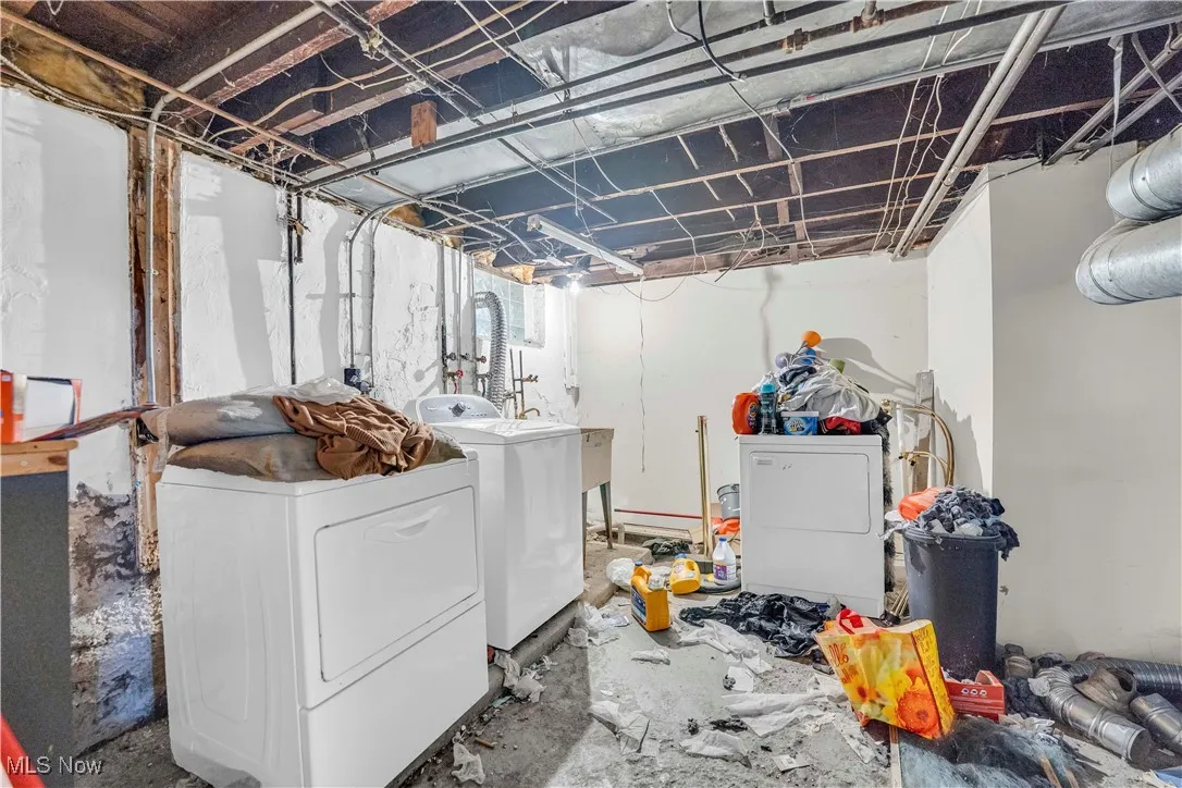 Laundry area with washer and clothes dryer