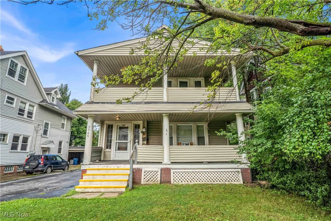 View of front of home featuring a porch and a front yard