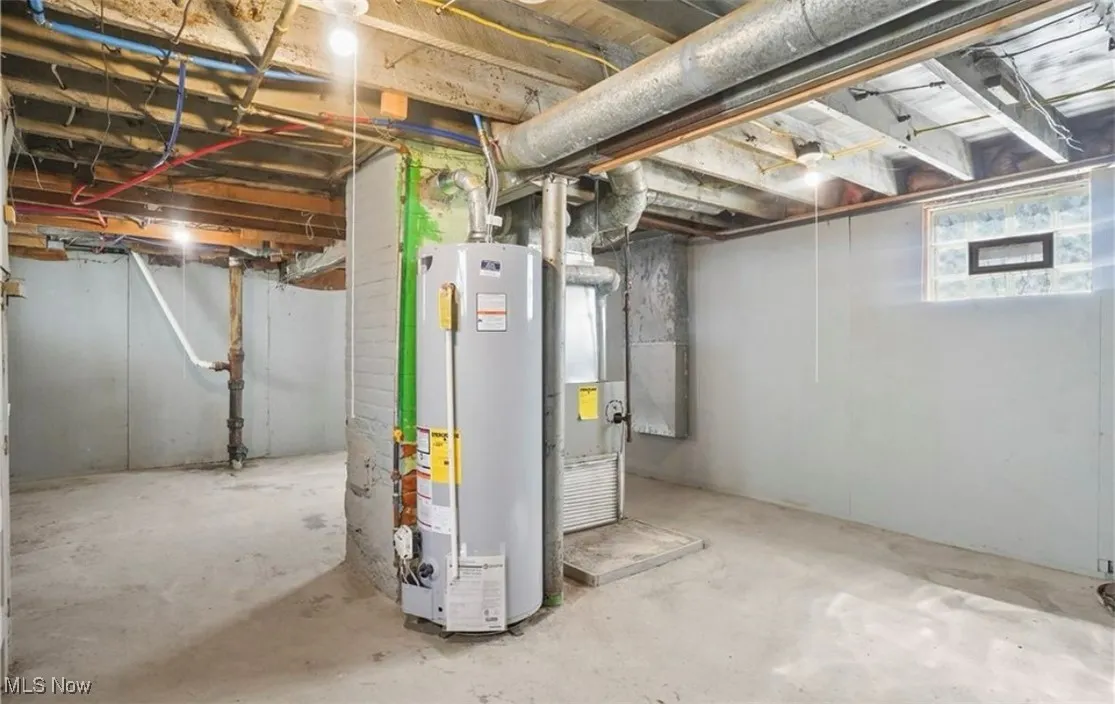 Below grade area featuring gas water heater