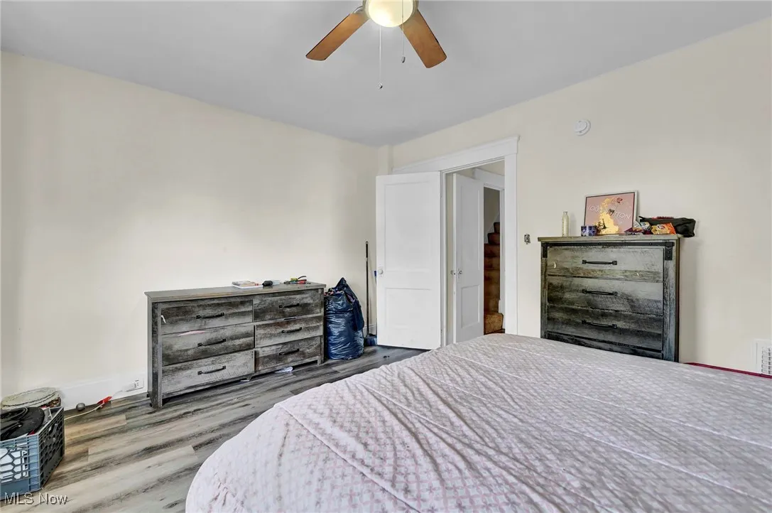 Bedroom featuring wood finished floors and a ceiling fan