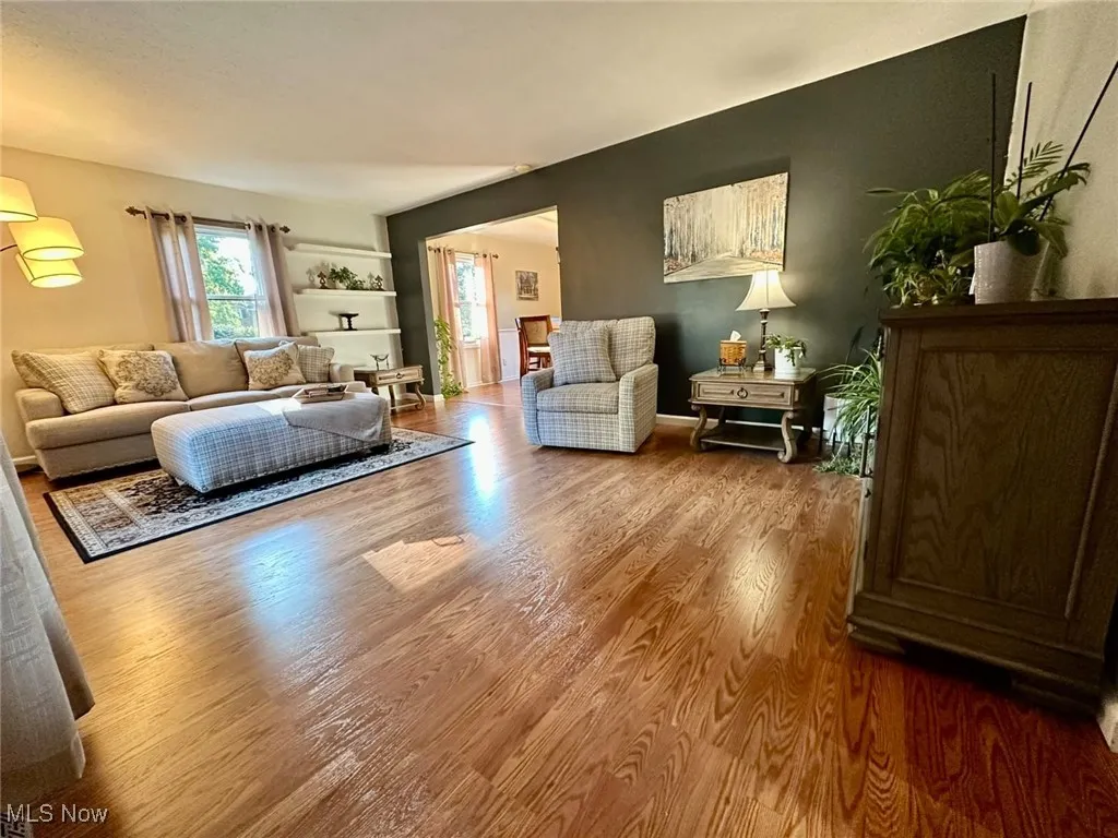 Living room with wood finished floors and baseboards