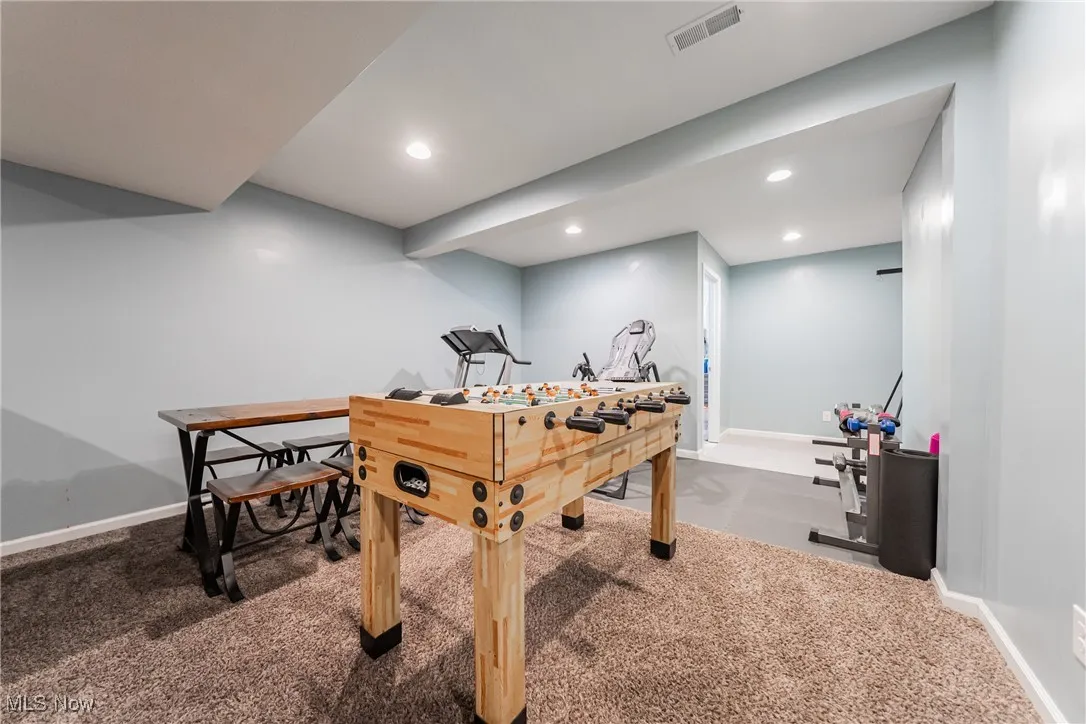 Basement with carpet flooring and recessed lighting