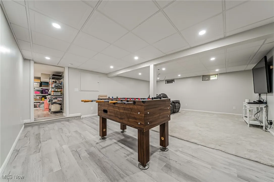 Playroom featuring light wood-style flooring and recessed lighting